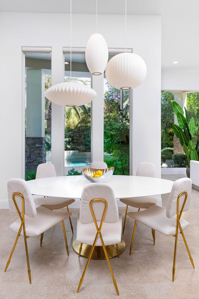 This oval table and these stunning chairs soften the dimensions in this space, bringing function and style to this little corner!
