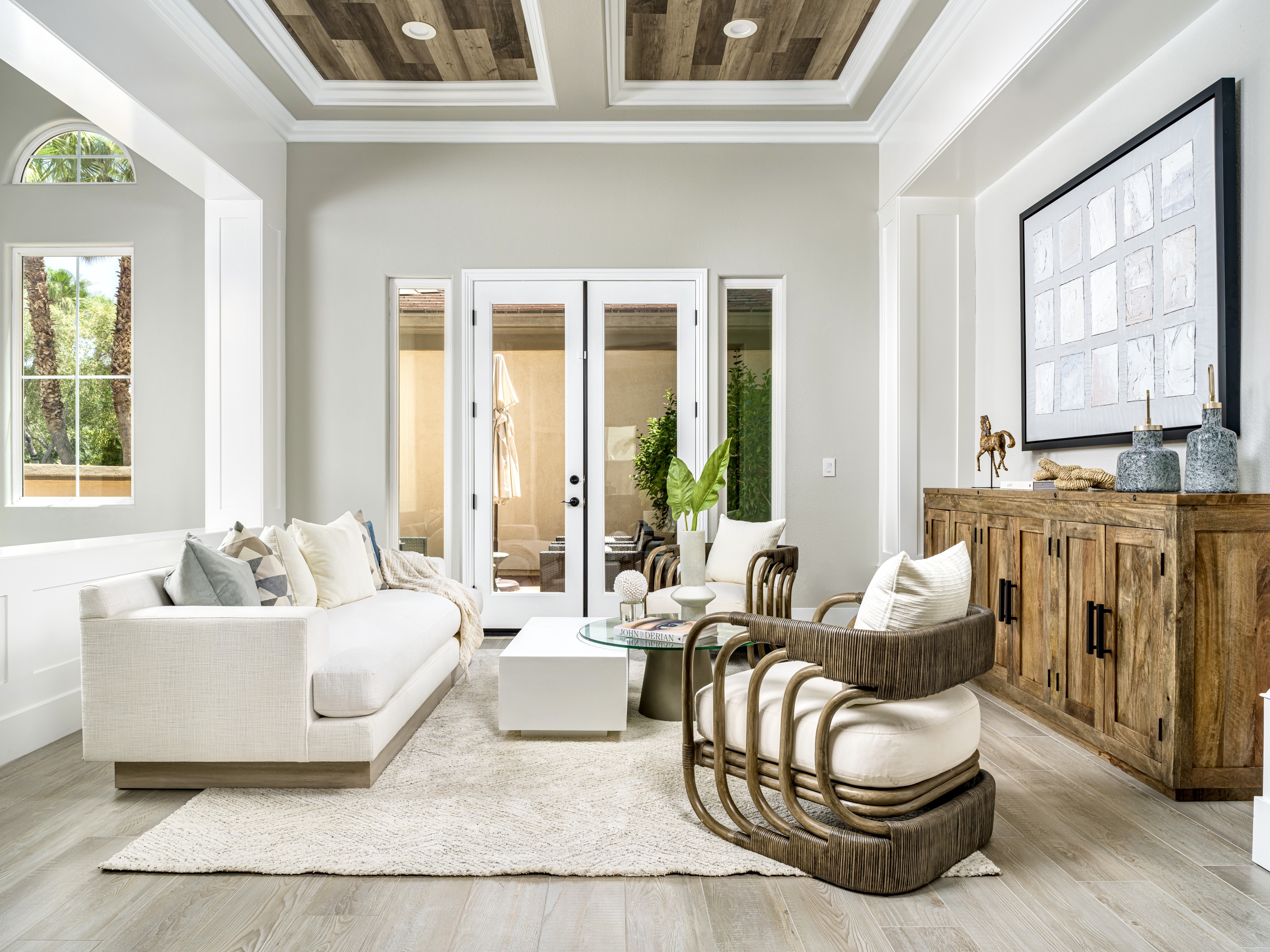 Neutral color palette in a staged living room. Bright and airy living room with natural light.